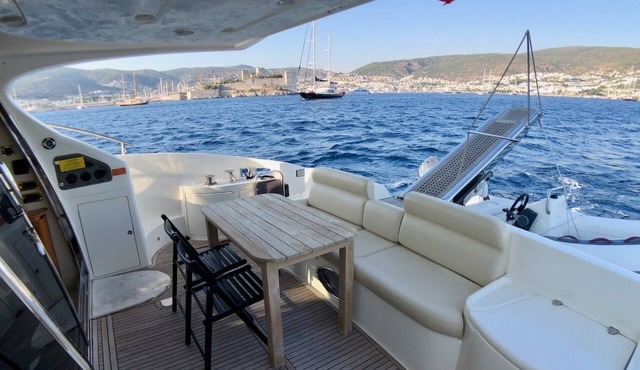 Stay at a luxury crewed 2011 Azimut 55 Fly yacht in Bodrum 3 cabins for 6 guests in Mugla