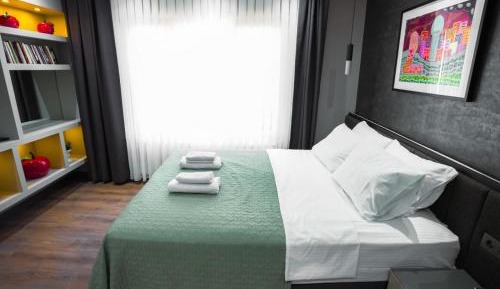 One-Bedroom Apartment with Balcony and City View